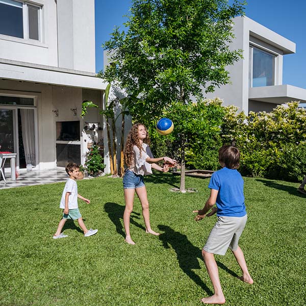 kids playing with ball in the yard